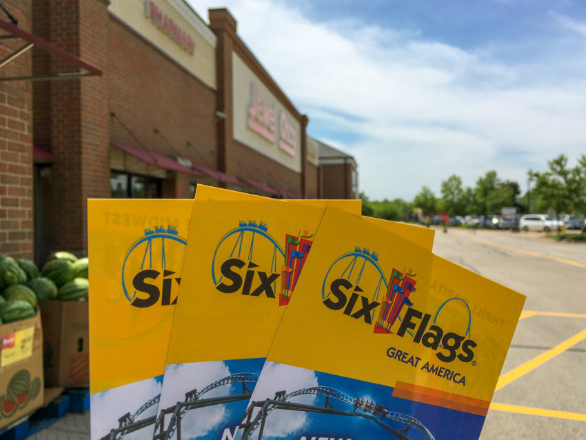 exterior of jewel osco grocery store with six flags brochures shown in foreground